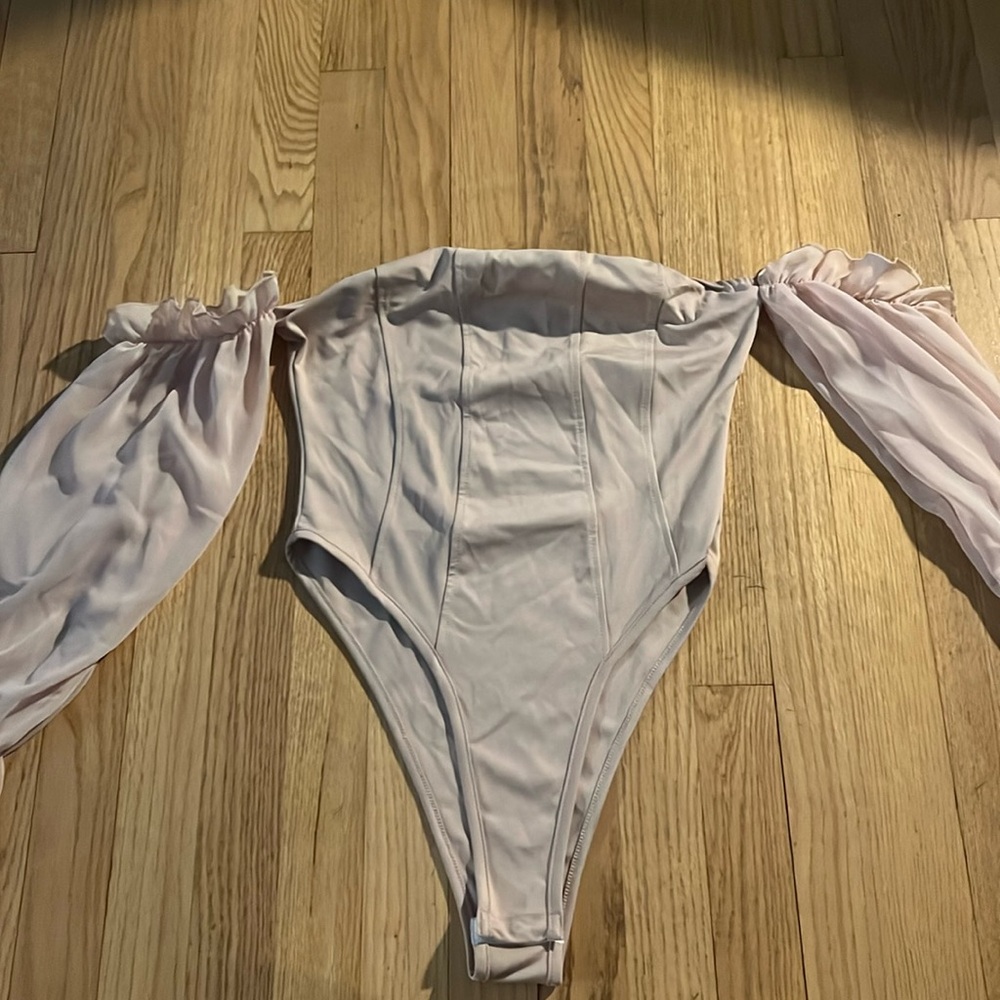 Never worn bodysuit with ruffle arms